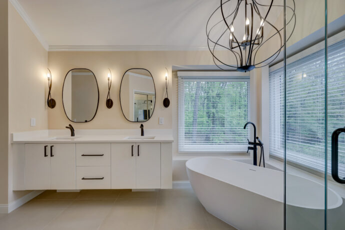 Custom luxury bathroom remodel with soaking tub and floating vanity in West Bloomfield Michigan
