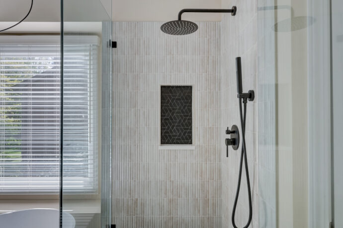Luxury bathroom remodel in West Bloomfield Michigan with floating vanity soaking tub and walk in shower