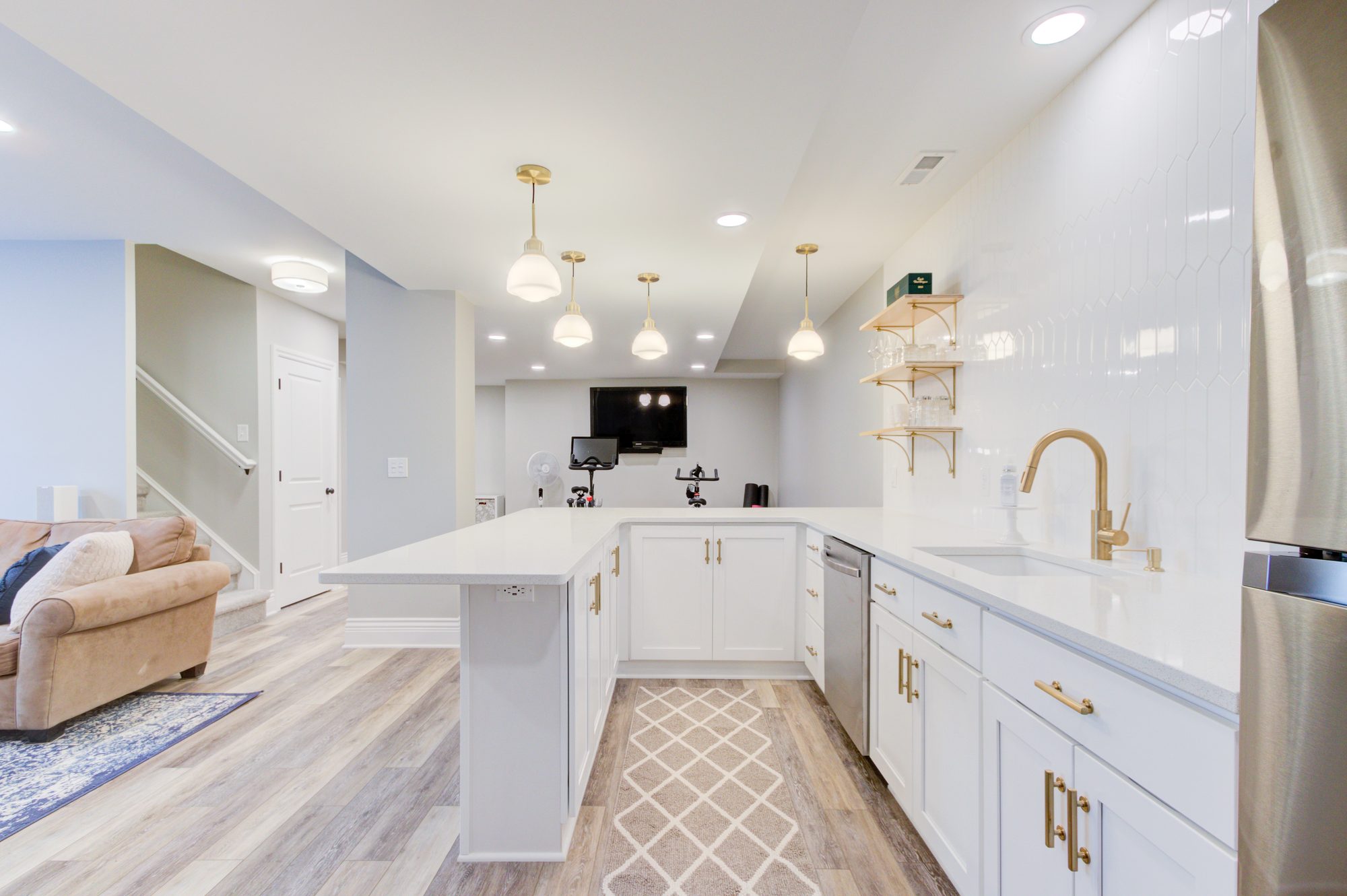 Wet bar looking toward the home gym area in a Birmingham MI basement remodel
