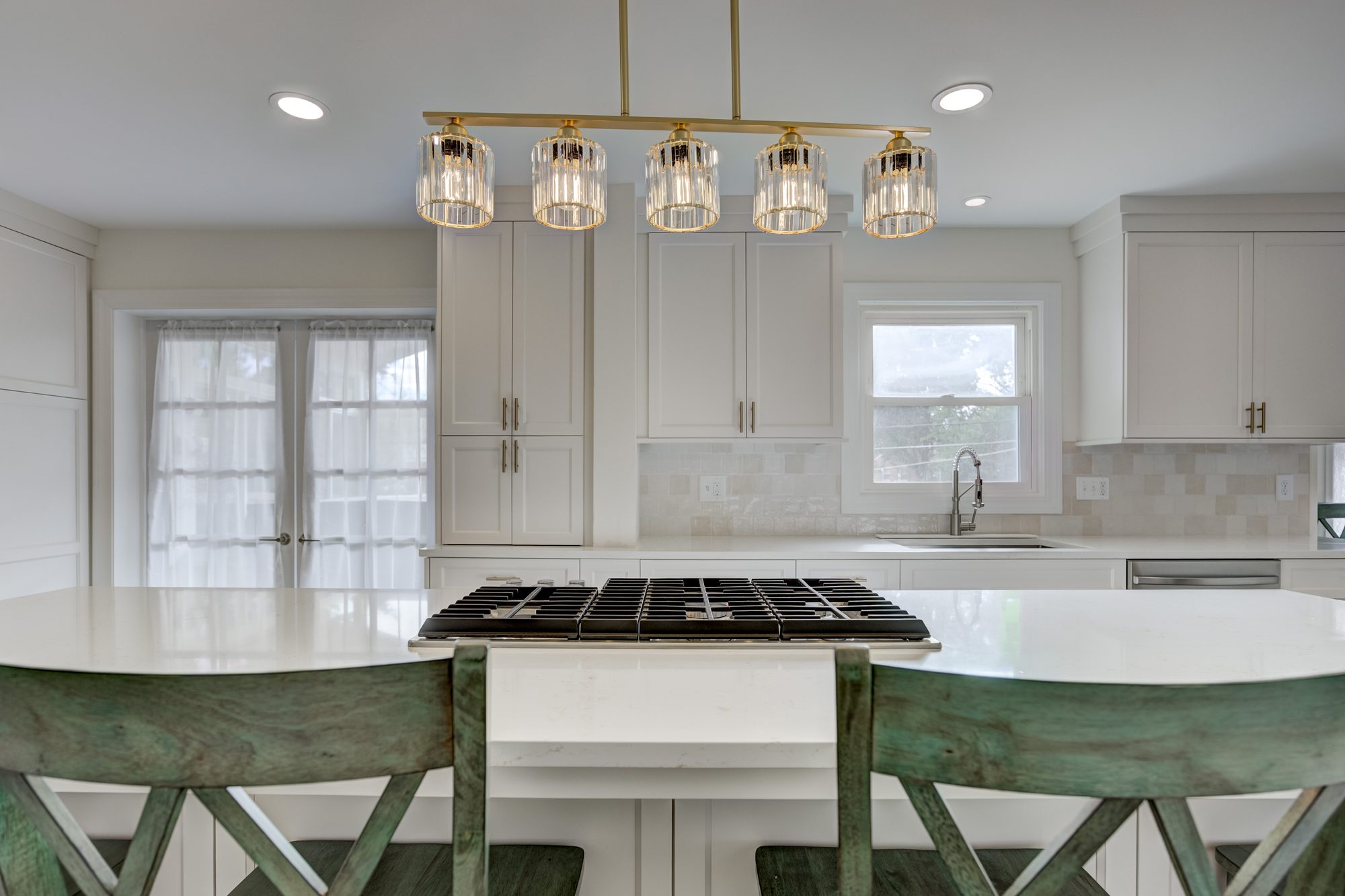 Kitchen looking toward the french doors with island seating in a Beverly Hills MI remodel