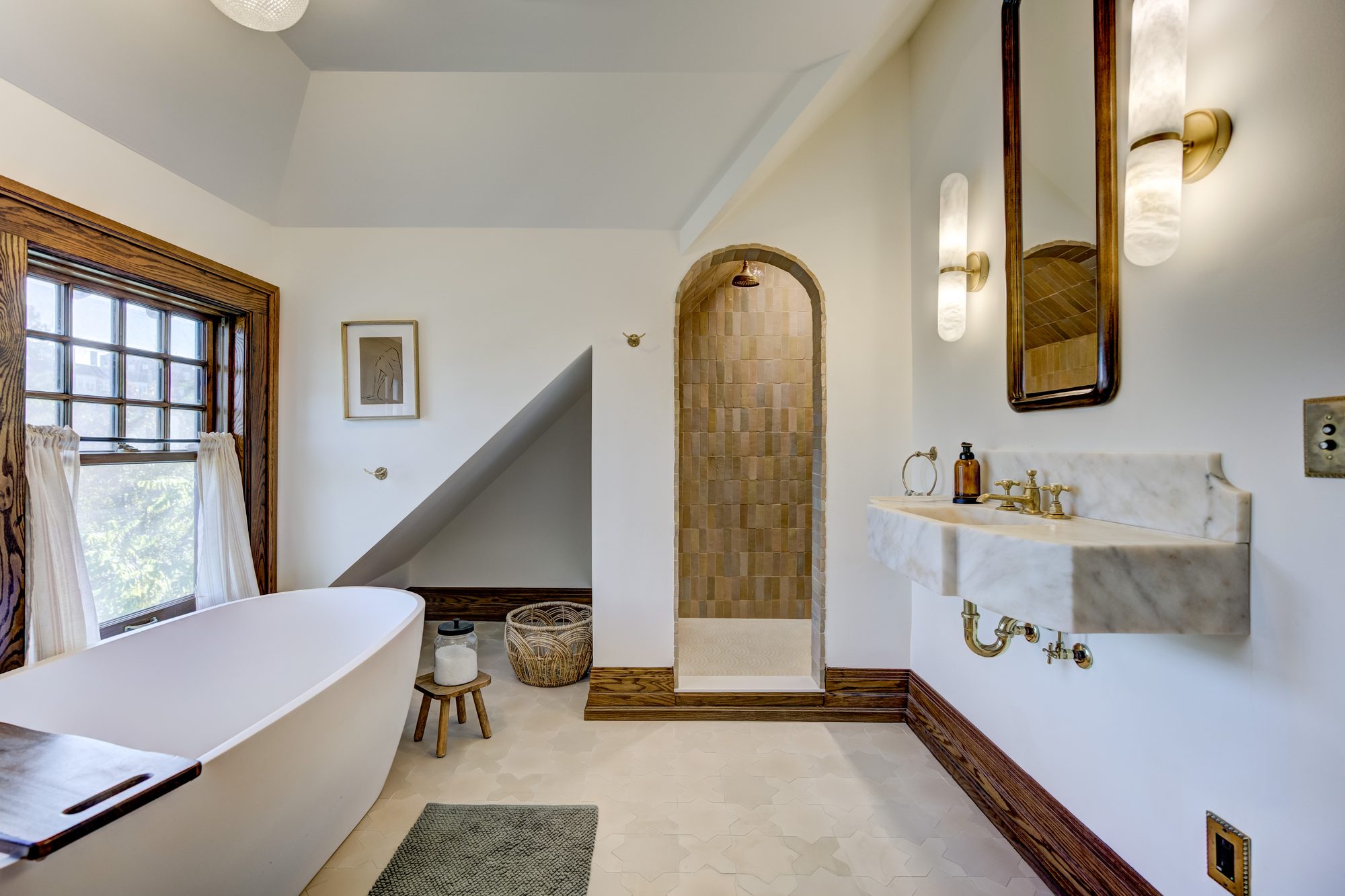 Arched zellige tile shower beside the antique marble sink in a Birmingham MI master bathroom remodel
